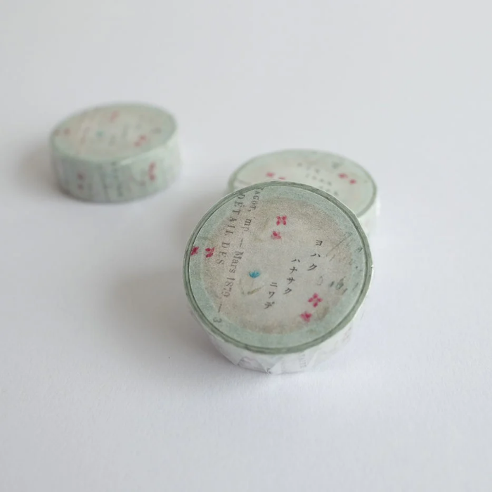 YOHAKU washi tape titled 'Flower Garden' (Y-068), featuring blue and red floral designs with typed lettering, perfect for journaling, scrapbooking, and adding floral accents to crafts.