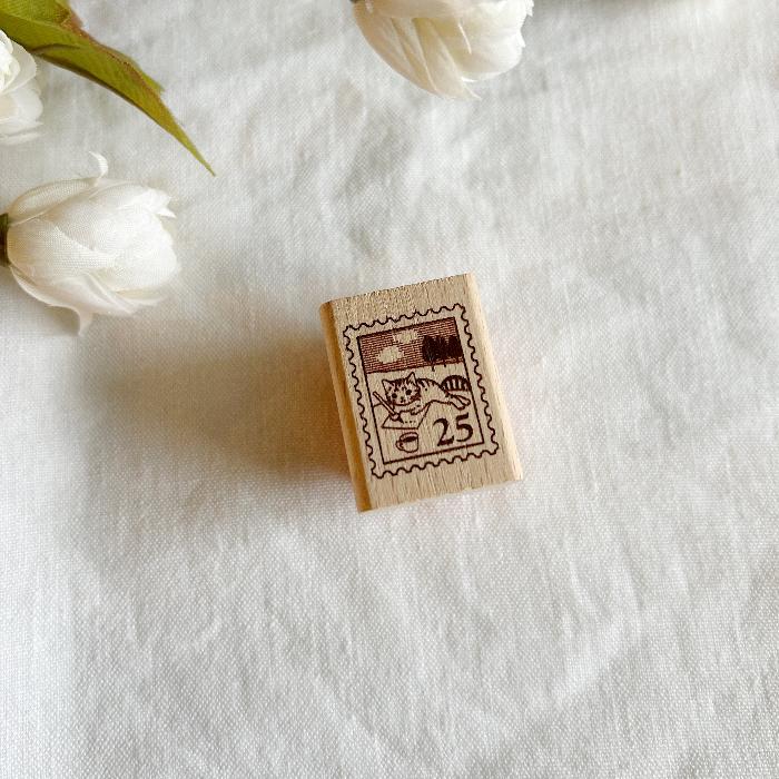Pottering Cat rubber stamp titled 'Postage Stamp,' featuring a whimsical cat within a postage stamp design, Japanese stationery ideal for adding a mail-themed, vintage touch to planners, journals, and crafts.