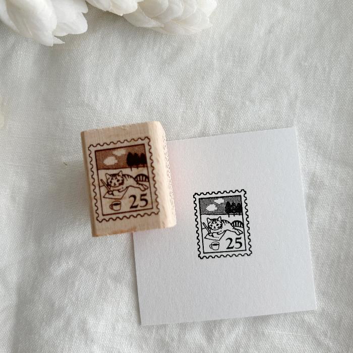 Pottering Cat rubber stamp titled 'Postage Stamp,' featuring a whimsical cat within a postage stamp design, Japanese stationery ideal for adding a mail-themed, vintage touch to planners, journals, and crafts.