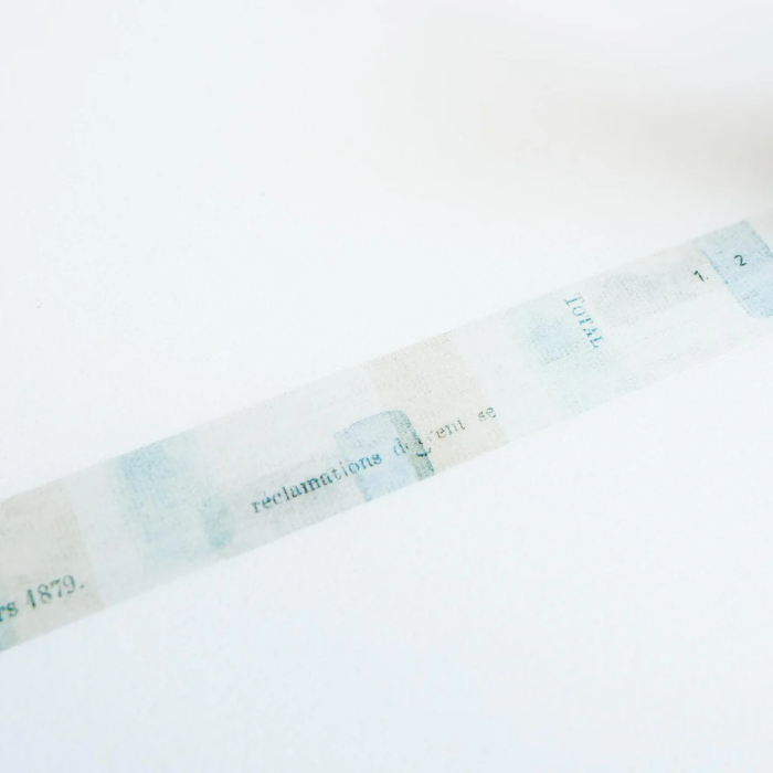 YOHAKU washi tape titled 'Secret Water' (Y-125), featuring a collage of muted blues, greens, and beige with vintage-style typed letters and numbers, ideal for adding a subtle, artistic layer to crafts, journals, and scrapbooks.
