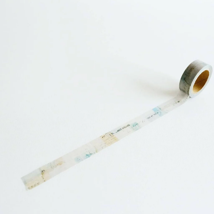 YOHAKU washi tape titled 'Secret Song' (Y-090), a collage design in muted blues, greens, and beige, featuring script and vintage-style typed letters, perfect for journals, crafts, and artistic layering.