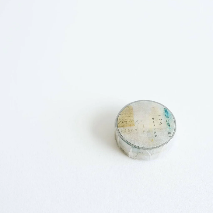 YOHAKU washi tape titled 'Secret Song' (Y-090), a collage design in muted blues, greens, and beige, featuring script and vintage-style typed letters, perfect for journals, crafts, and artistic layering.