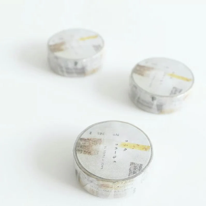YOHAKU washi tape titled 'Collage' (Y-009), featuring a beige and soft grey background with numbers and typed lettering for a vintage, minimalist style, perfect for enhancing journals, planners, and creative collages.
