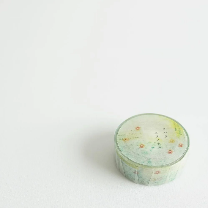 YOHAKU washi tape titled 'In A Dream' (Y-081), featuring delicate soft pink flowers on a lush green background, ideal for journaling, scrapbooking, and adding a botanical touch to crafts.