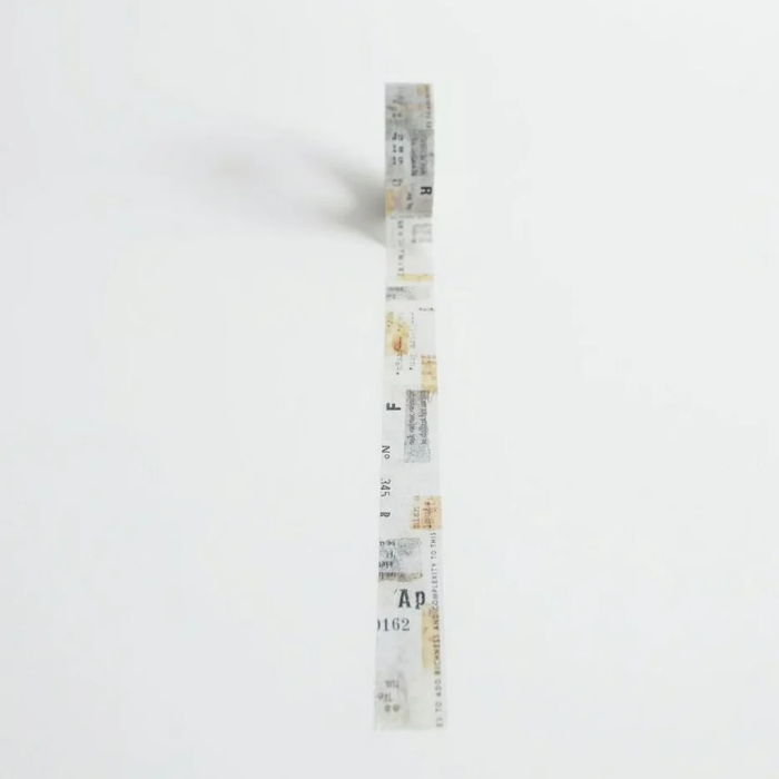 YOHAKU washi tape titled 'Collage' (Y-009), featuring a beige and soft grey background with numbers and typed lettering for a vintage, minimalist style, perfect for enhancing journals, planners, and creative collages.