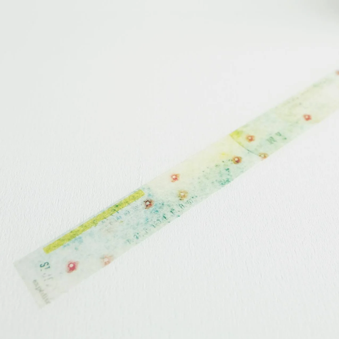 YOHAKU washi tape titled 'In A Dream' (Y-081), featuring delicate soft pink flowers on a lush green background, ideal for journaling, scrapbooking, and adding a botanical touch to crafts.