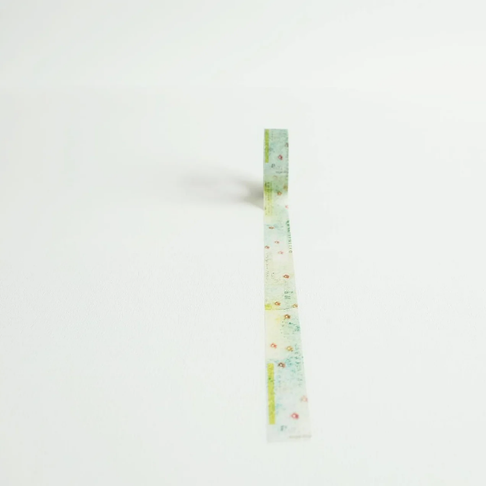 YOHAKU washi tape titled 'In A Dream' (Y-081), featuring delicate soft pink flowers on a lush green background, ideal for journaling, scrapbooking, and adding a botanical touch to crafts.