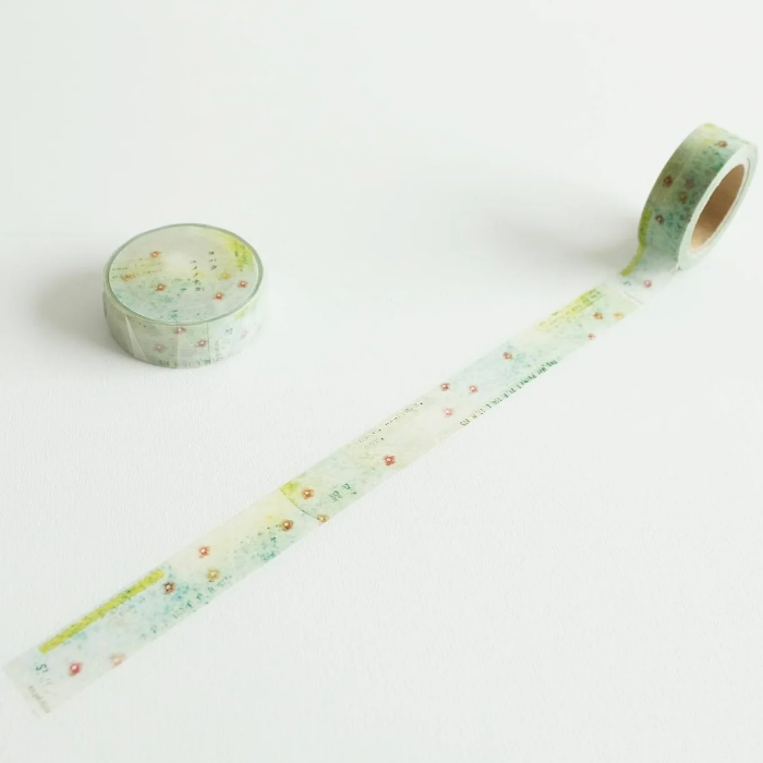 YOHAKU washi tape titled 'In A Dream' (Y-081), featuring delicate soft pink flowers on a lush green background, ideal for journaling, scrapbooking, and adding a botanical touch to crafts.