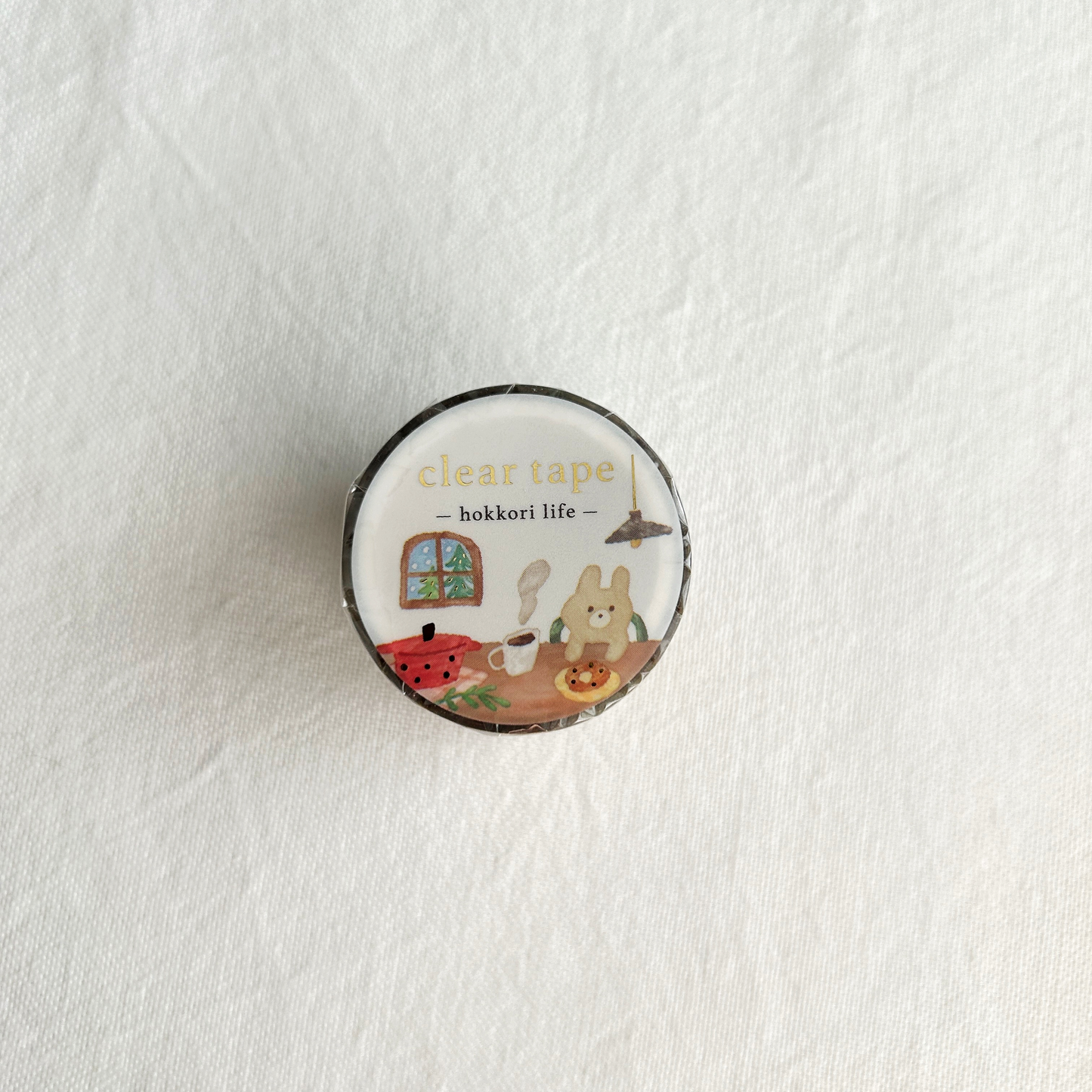 Hokkori Life Gold Foil Clear Tape - Home. The gentle, transparent background and warm, inviting details make this tape perfect for adding a touch of whimsy to journals, planners, or any project that calls for a cozy, homey feel with an adorable touch.