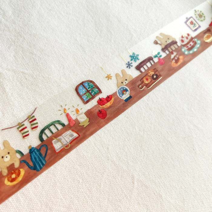Hokkori Life Gold Foil Clear Tape - Home. The gentle, transparent background and warm, inviting details make this tape perfect for adding a touch of whimsy to journals, planners, or any project that calls for a cozy, homey feel with an adorable touch.