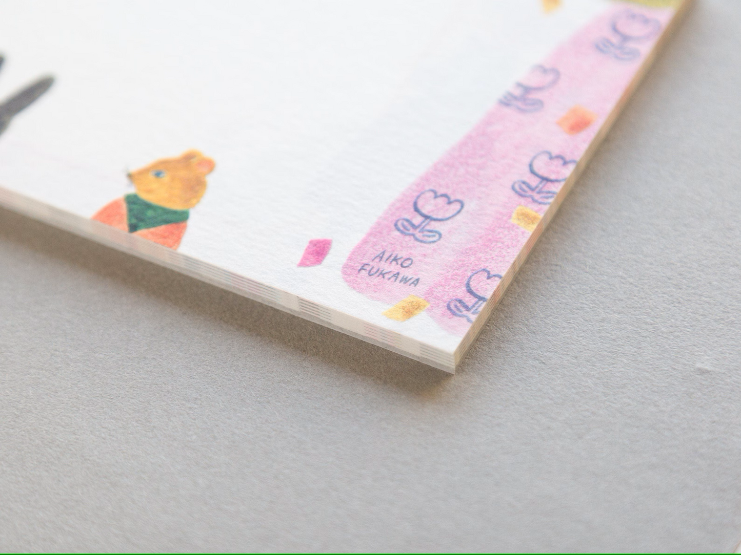 Aiko Fukawa memo pad titled 'Serendipity,' featuring playful, whimsical illustrations of animals and nature elements, Japanese stationery with an enchanting, artistic style.
