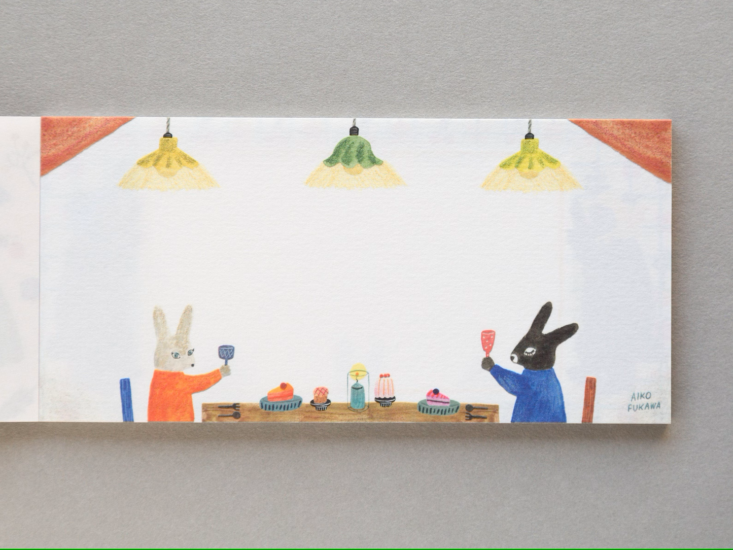 Aiko Fukawa memo pad titled 'Serendipity,' featuring playful, whimsical illustrations of animals and nature elements, Japanese stationery with an enchanting, artistic style.