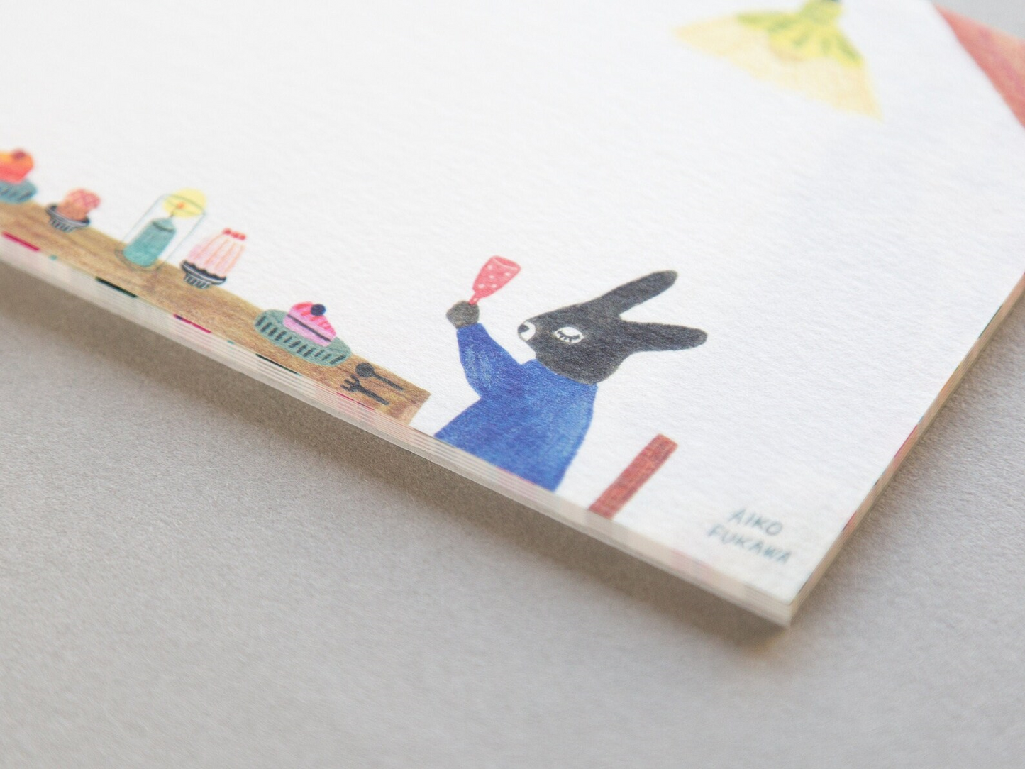 Aiko Fukawa memo pad titled 'Serendipity,' featuring playful, whimsical illustrations of animals and nature elements, Japanese stationery with an enchanting, artistic style.