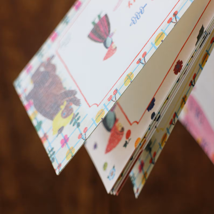 Aiko Fukawa memo pad titled 'Serendipity,' featuring playful, whimsical illustrations of animals and nature elements, Japanese stationery with an enchanting, artistic style.
