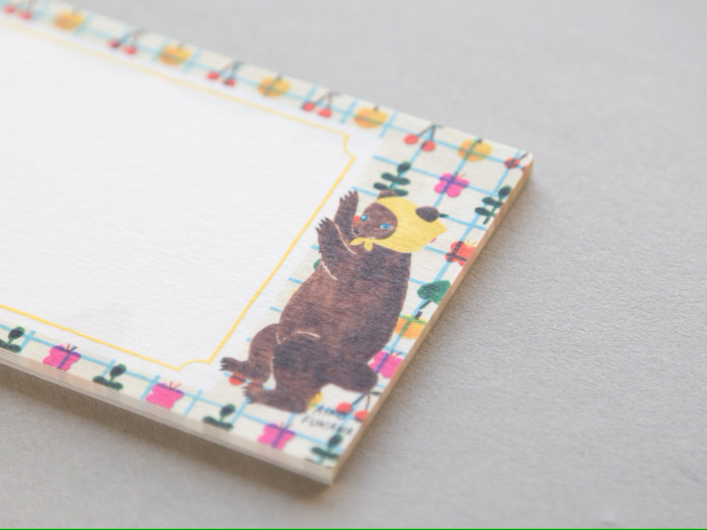 Aiko Fukawa memo pad titled 'Serendipity,' featuring playful, whimsical illustrations of animals and nature elements, Japanese stationery with an enchanting, artistic style.