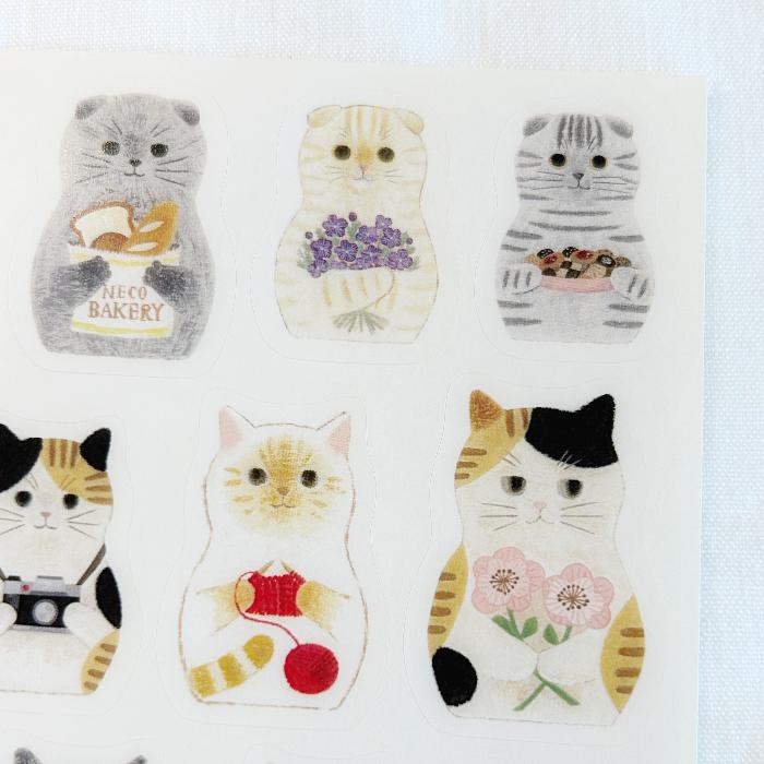 4Legs sticker sheet titled 'Cat Matryoshka,' featuring adorable cat illustrations inspired by matryoshka dolls, Japanese stationery ideal for decorating planners, journals, and crafts.