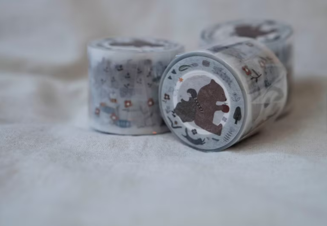 Ivy Snow matte PET tape titled 'In The Forest,' featuring whimsical forest-themed illustrations with animals, trees, and nature elements, Japanese stationery ideal for adding a nature-inspired touch to planners, journals, and crafts.