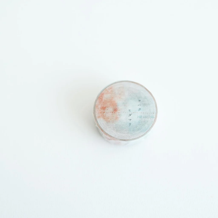 YOHAKU washi tape titled 'Sunlight' (Y-101) with watercolor-style soft blues and orange tones, perfect for adding a serene, artistic touch to journaling, scrapbooking, and crafts.