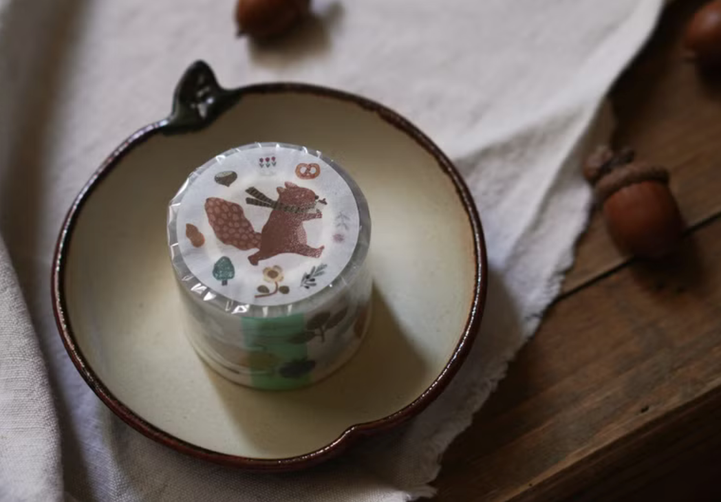 Ivy Snow matte PET tape titled 'The Forest Kitchen,' featuring charming illustrations of forest animals, fruits, and kitchen items, Japanese stationery ideal for adding a whimsical, nature-inspired touch to planners, journals, and crafts.