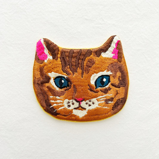 Embroidered pouch of a cat's face