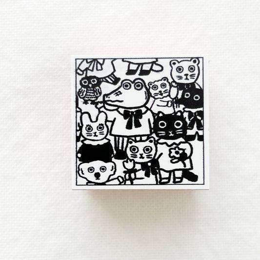 A square wooden rubber stamps of animals including alligator, bird, bear, cats and bunny