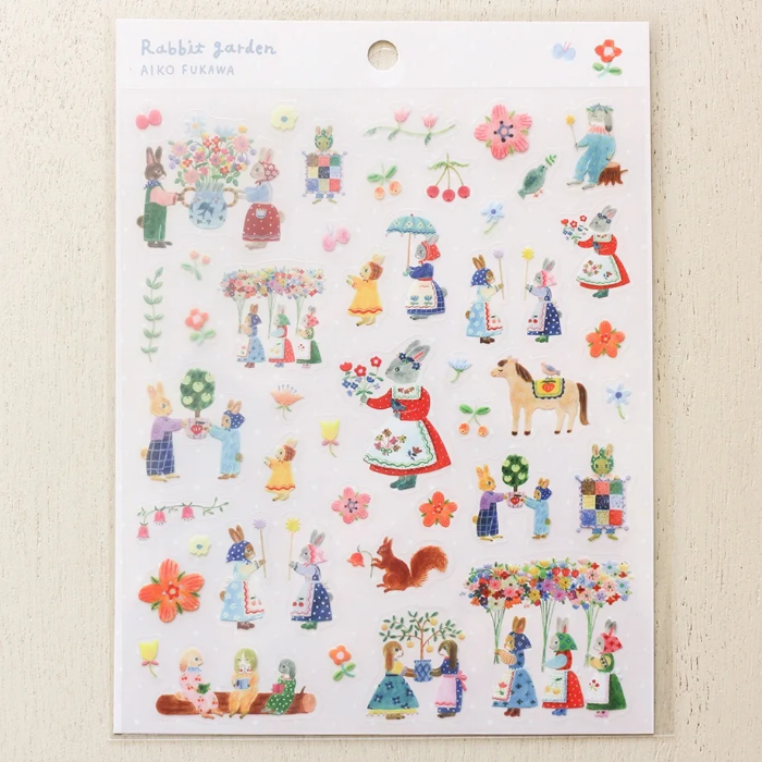 Aiko Fukawa clear sticker sheet titled 'Rabbit Garden,' featuring charming illustrations of rabbits among flowers and garden elements, Japanese stationery perfect for decorating planners, journals, and scrapbooks.