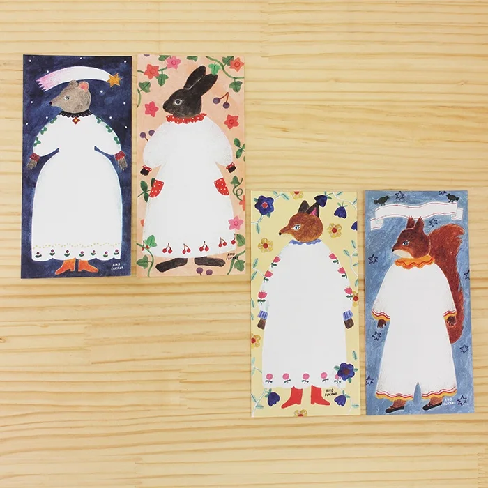Aiko Fukawa memo pad titled 'Paper Dress,' featuring elegant illustrations of dresses, flowers, and whimsical details, Japanese stationery with a delicate, fashion-inspired theme.