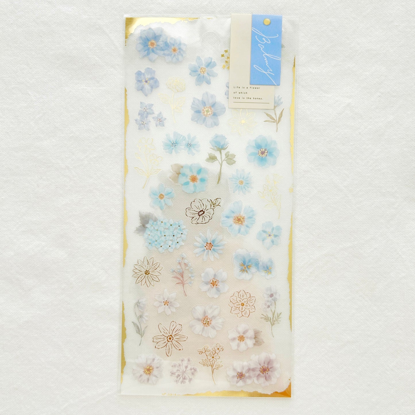Sticker sheet with graceful blue flowers with gradient colors adorned with delicate gold foil details. 