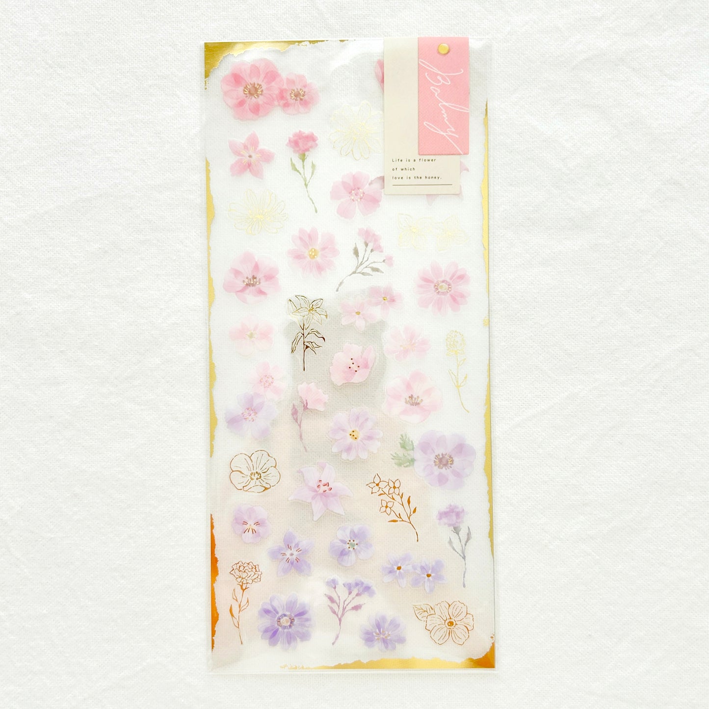 Sticker sheet  features graceful pink flowers with gradient colors adorned with delicate gold foil details. 