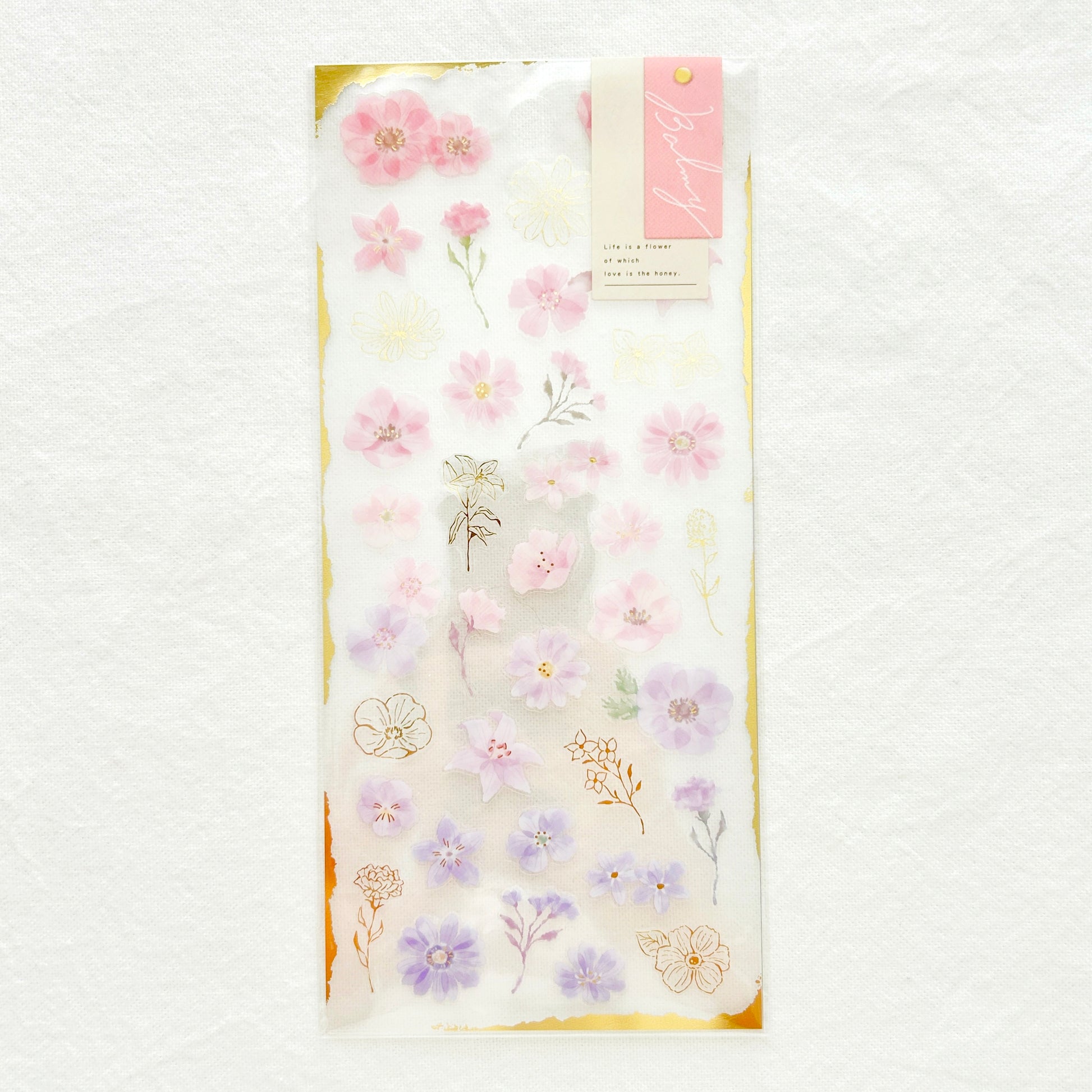 Sticker sheet  features graceful pink flowers with gradient colors adorned with delicate gold foil details. 