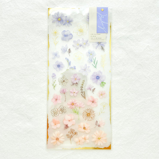 Sticker sheet features graceful purple flowers with gradient colors adorned with delicate gold foil details.