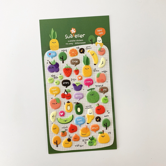 Sheet of colorful stickers with cute fruit and vegetable designs on a green background