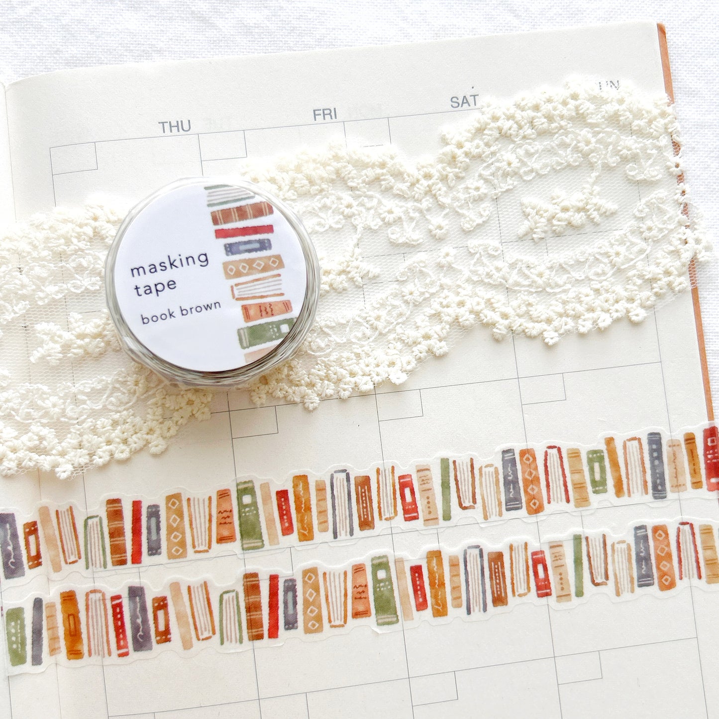 Washi tape with a charming brown book design on a planner