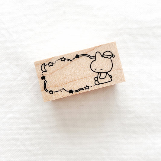 Wooden stamp with a cute sleeping bunny with moon and stars design