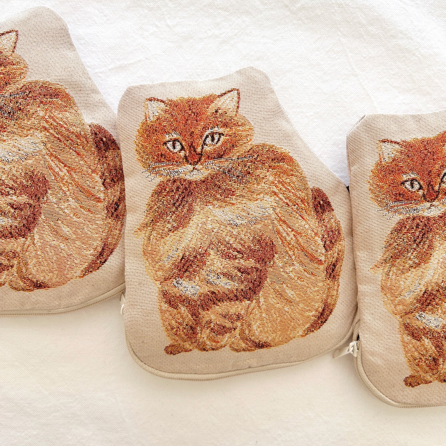 Embroidered cat design on a zipper pouch