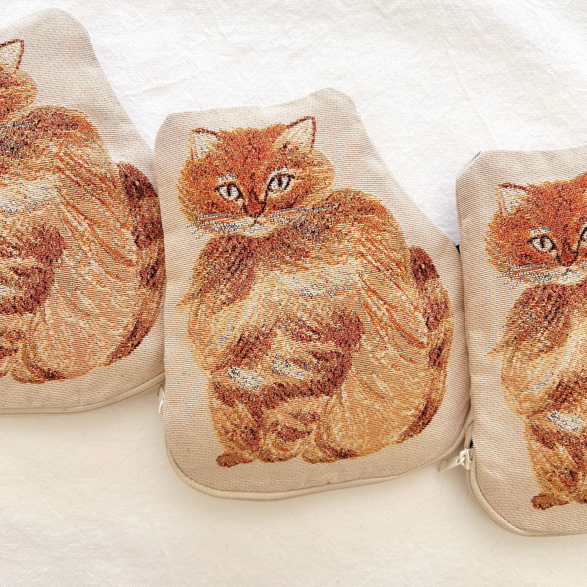 Embroidered cat design on a zipper pouch