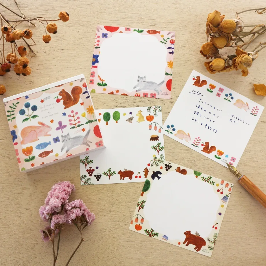 Aiko Fukawa memo pad titled 'Feel Nature,' featuring whimsical illustrations of animals, plants, and nature scenes, Japanese stationery with a soft, artistic style.