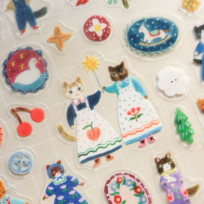 Aiko Fukawa clear sticker sheet titled 'Cats and Buttons,' featuring whimsical illustrations of playful cats and colorful buttons, Japanese stationery ideal for decorating planners, journals, and crafts.