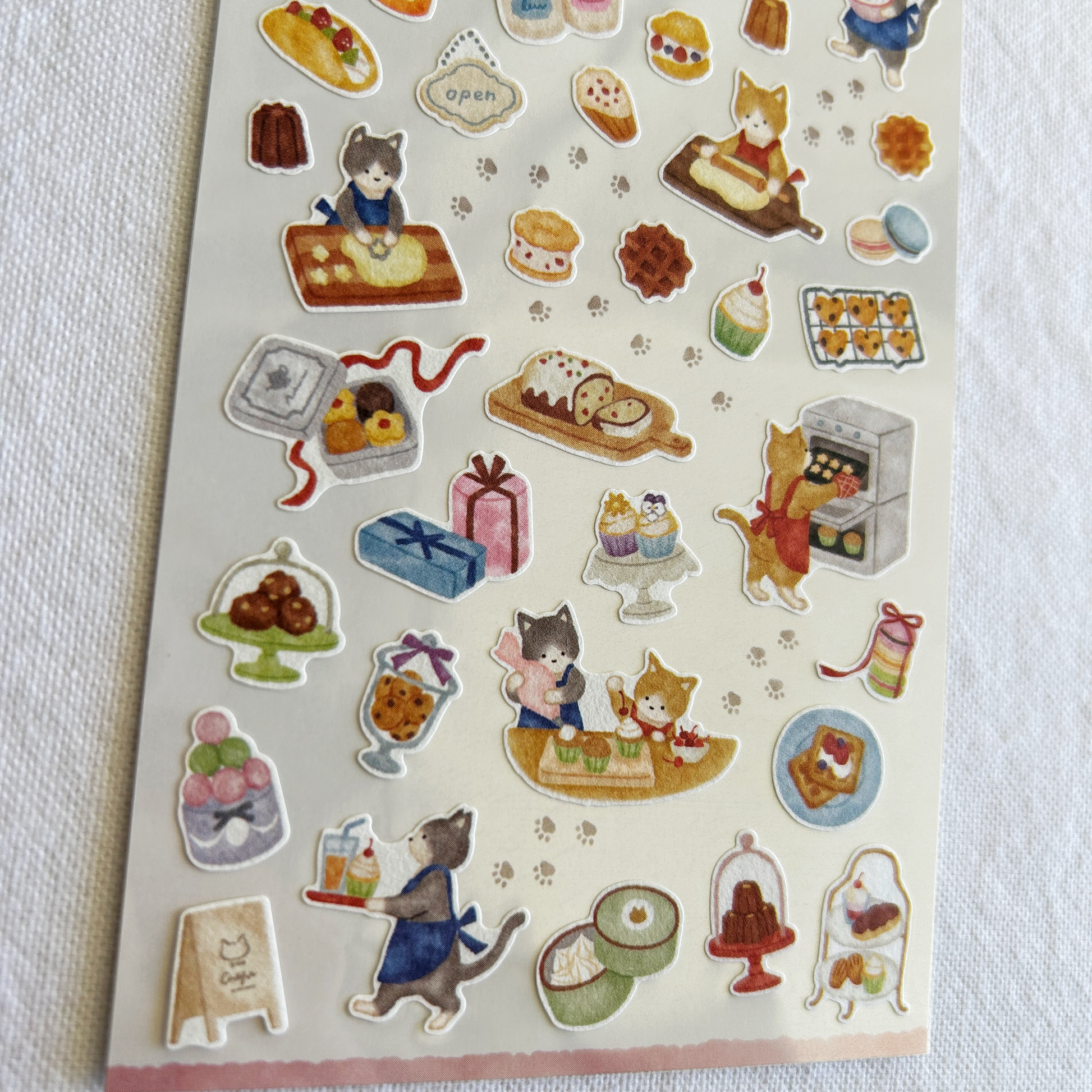 Mind Wave Little Kitchen - Cat's Confectionery Shop sticker sheet. Perfect for adorning planners, recipe books, scrapbooks, or any project that calls for a sprinkle of sweetness.