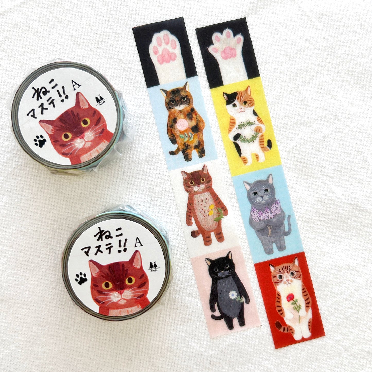 4Legs washi tape of various cats holding flowers