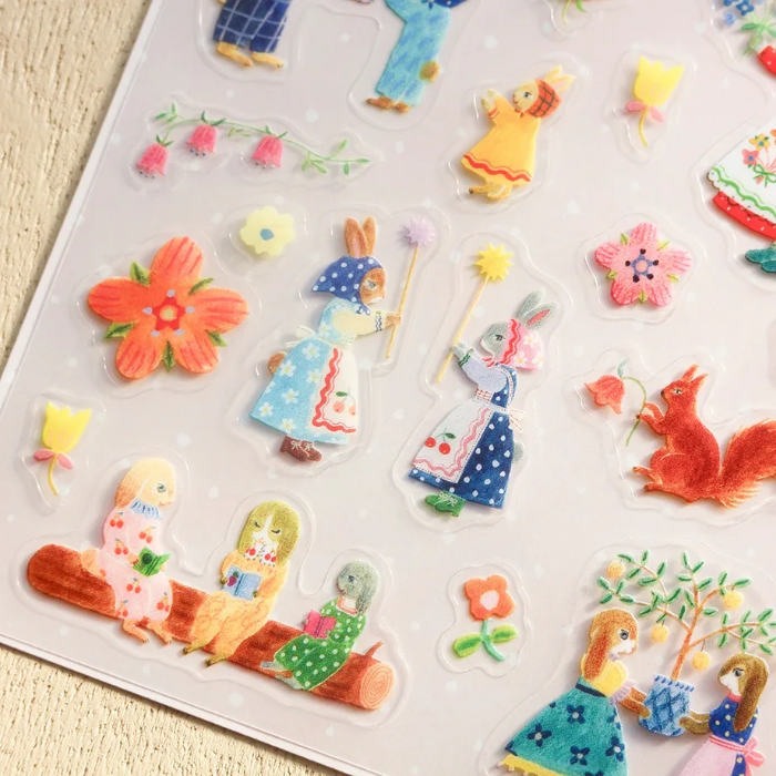 Aiko Fukawa clear sticker sheet titled 'Rabbit Garden,' featuring charming illustrations of rabbits among flowers and garden elements, Japanese stationery perfect for decorating planners, journals, and scrapbooks.