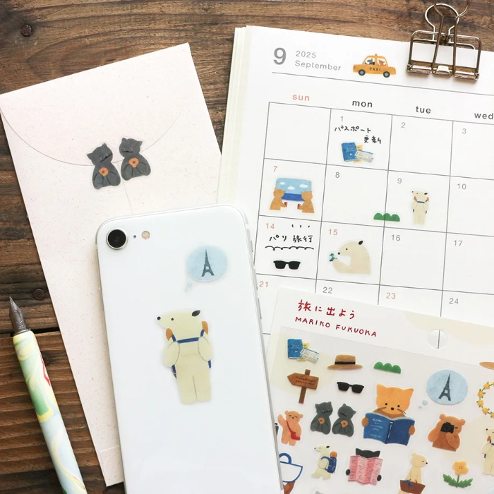 Mariko Fukuoka clear sticker sheet titled 'Let's Go On A Trip,' featuring playful travel-themed illustrations of luggage, maps, and cute characters, Japanese stationery perfect for decorating planners, journals, and scrapbooks.