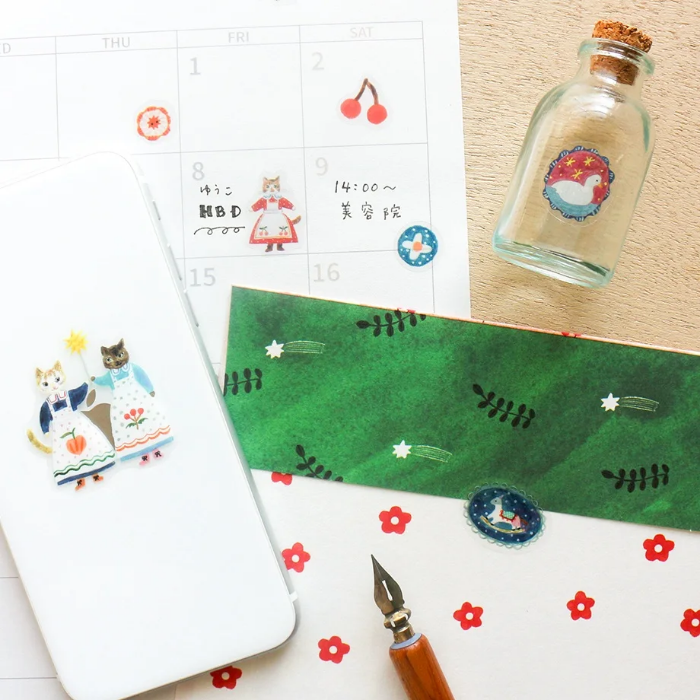 Aiko Fukawa clear sticker sheet titled 'Cats and Buttons,' featuring whimsical illustrations of playful cats and colorful buttons, Japanese stationery ideal for decorating planners, journals, and crafts.