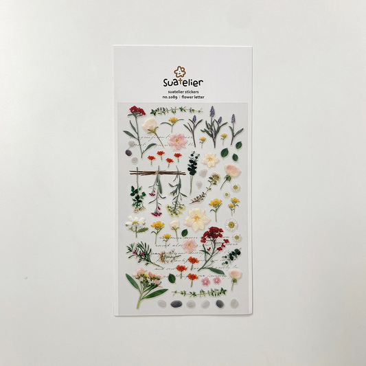 Sticker sheet of pressed flowers and leaves.