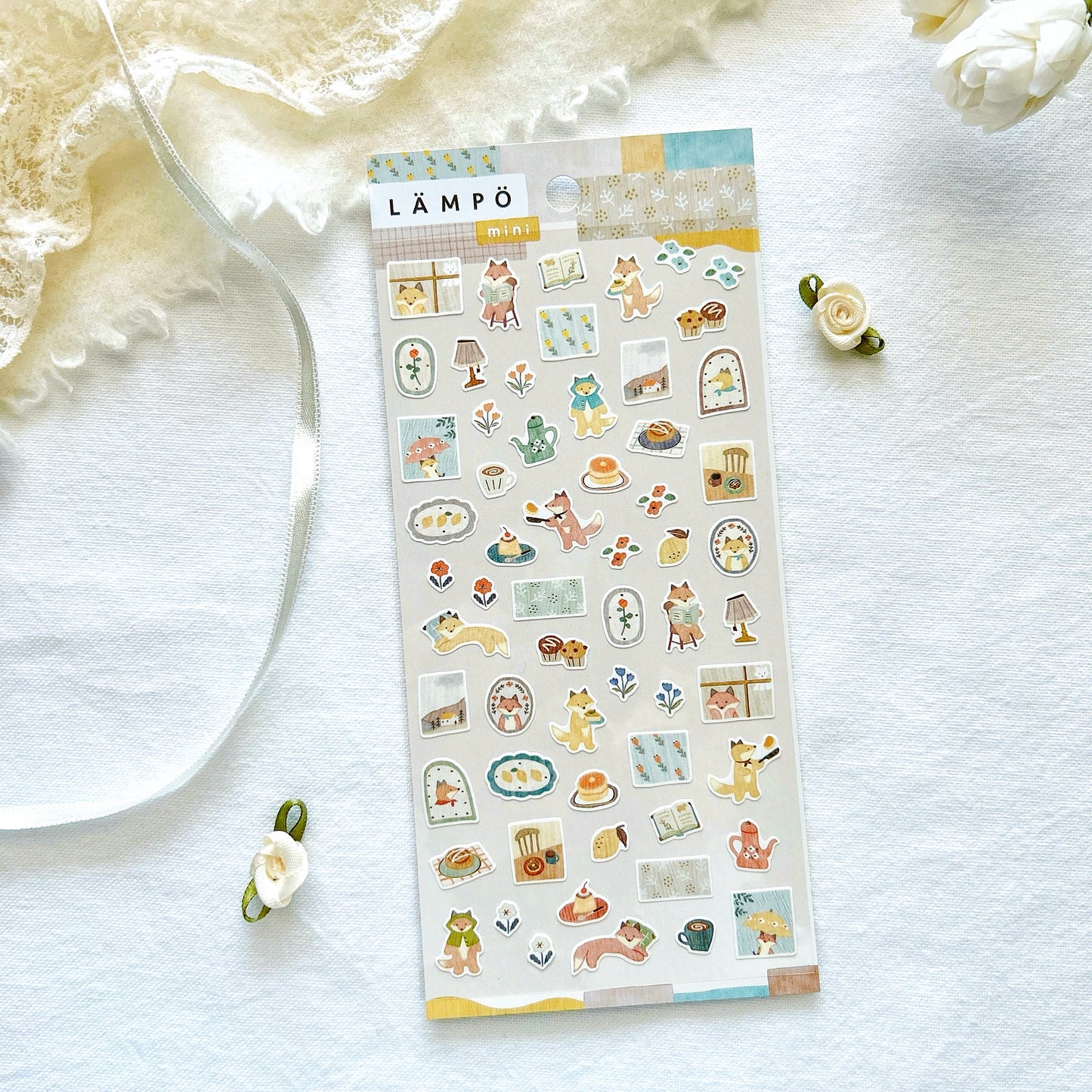 Sheet of decorative stickers with various illustrations of cute kawaii fox on a textured surface.