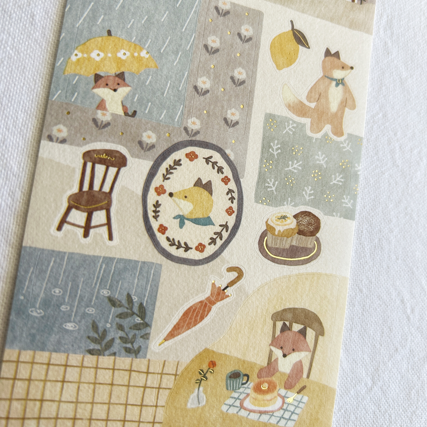 Mind Wave Lampo - Fox and Rain sticker sheet. Perfect for adding a relaxed, cozy touch to journals, planners, and scrapbooks.