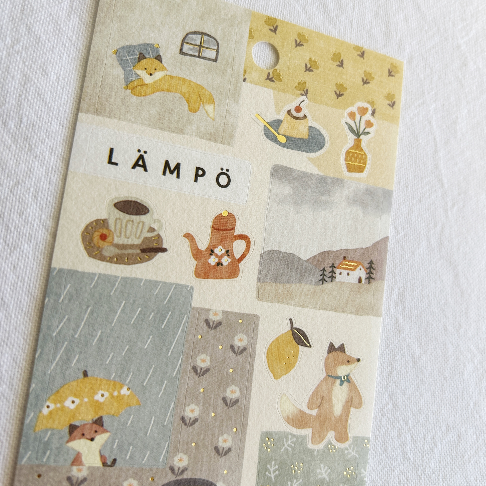 Mind Wave Lampo - Fox and Rain sticker sheet. Perfect for adding a relaxed, cozy touch to journals, planners, and scrapbooks.