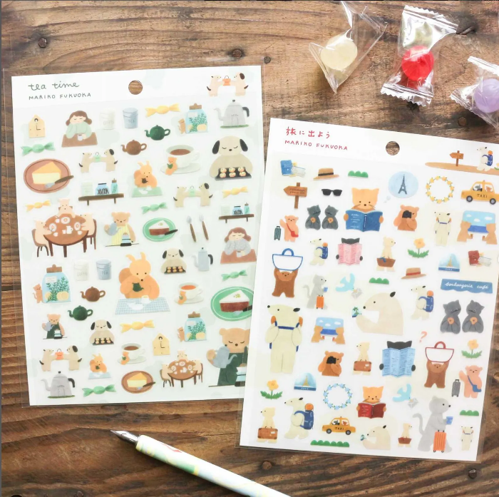 Mariko Fukuoka clear sticker sheet titled 'Let's Go On A Trip,' featuring playful travel-themed illustrations of luggage, maps, and cute characters, Japanese stationery perfect for decorating planners, journals, and scrapbooks.