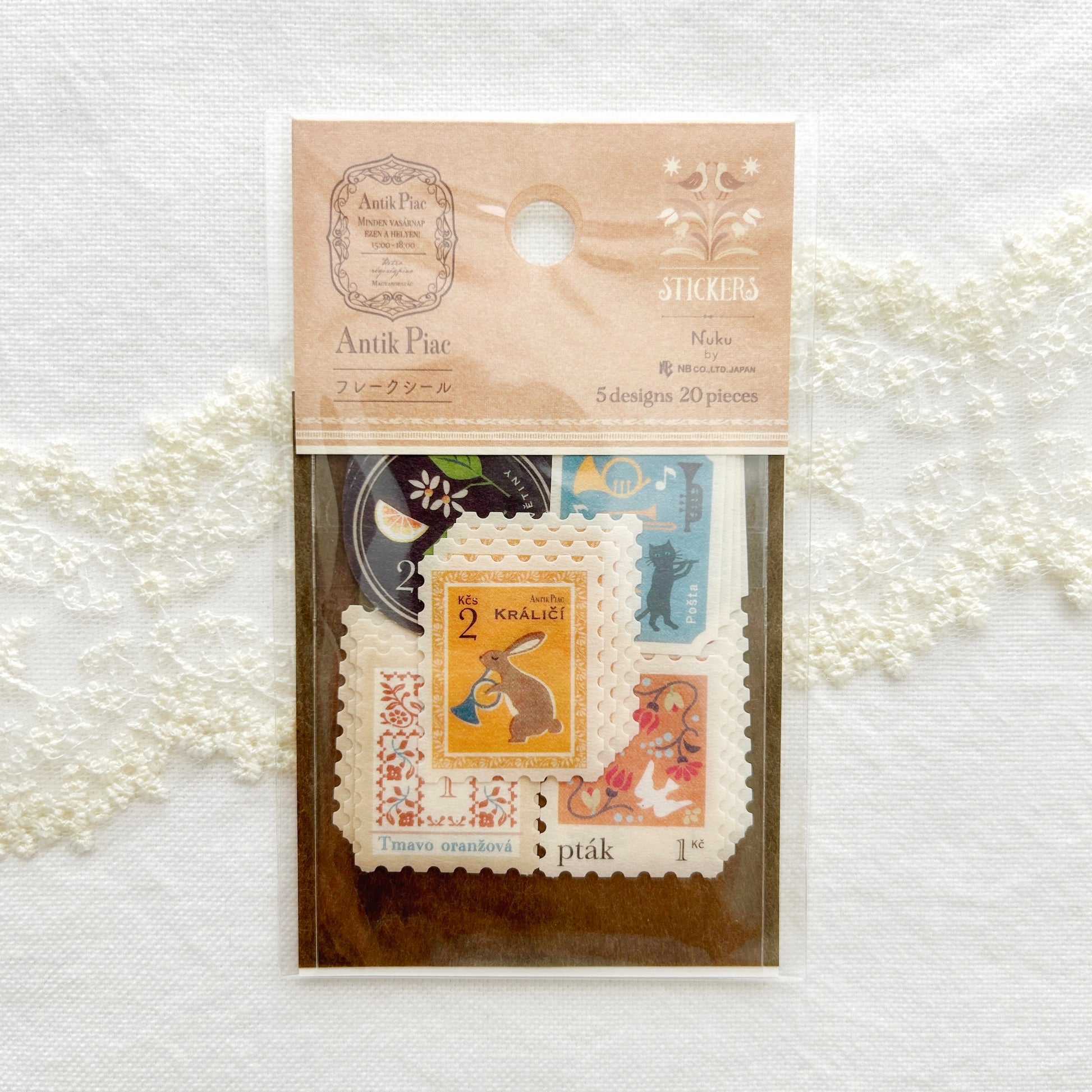 Packaged stickers with vintage design set in calming apricot hues, illustrations features bunnies, birds, cats and fruits printed on textured Japanese paper