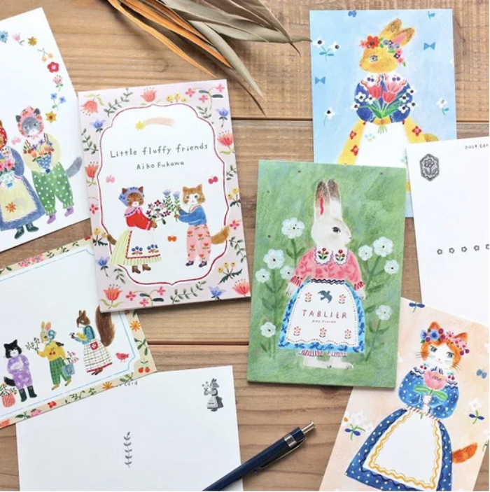 Aiko Fukawa postcard booklet titled 'Tablier,' featuring delightful illustrations of animals, flowers, and everyday scenes, Japanese stationery with a whimsical and artistic style.